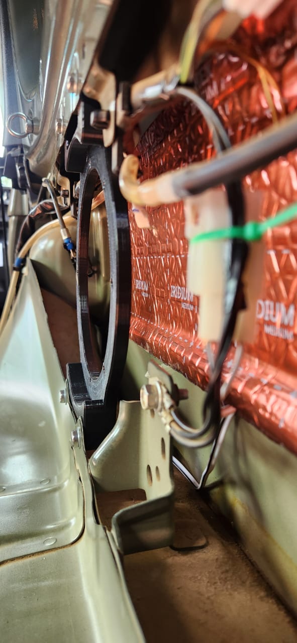 Side clearance view of rear speaker bracket and panel